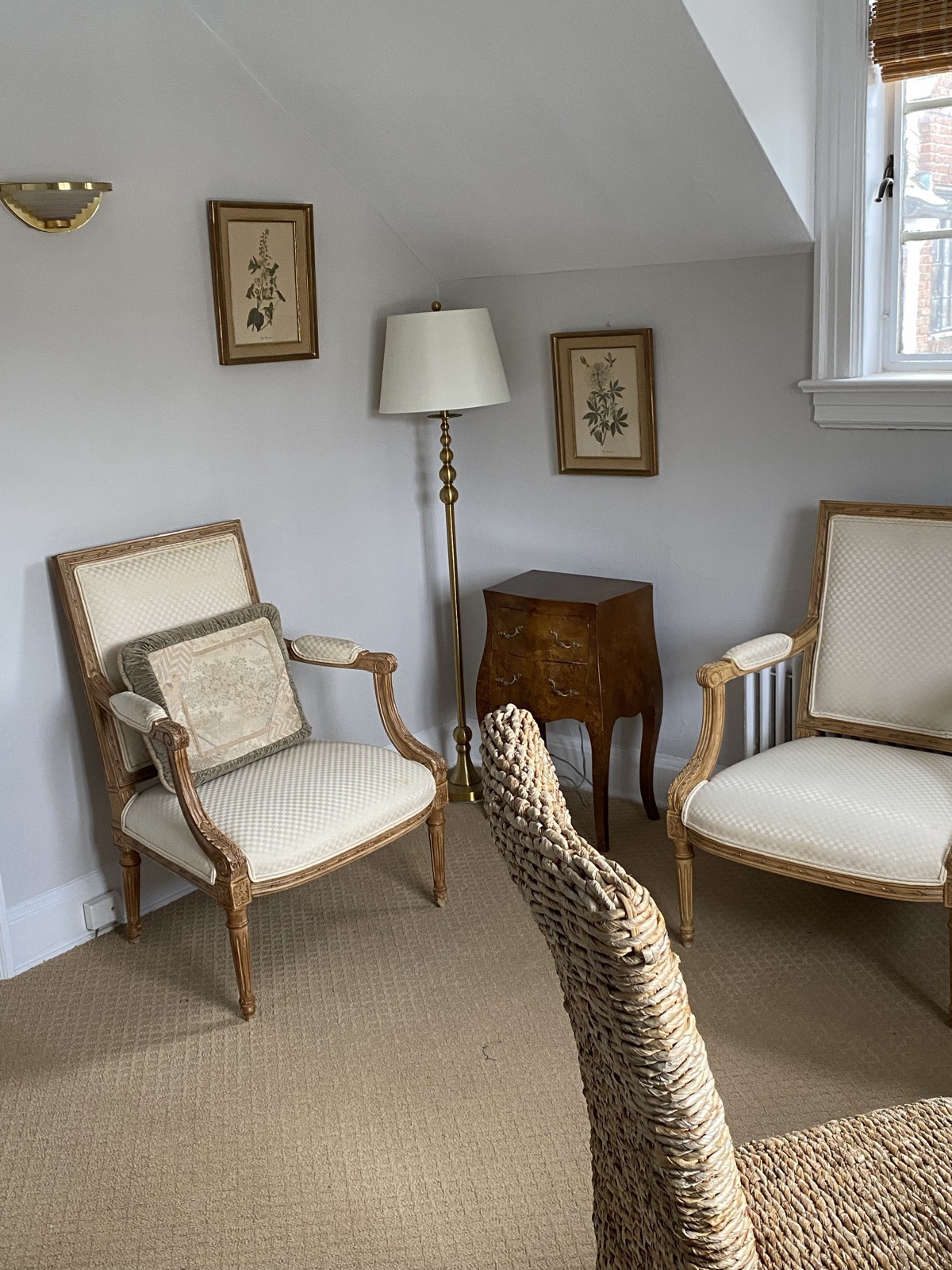 Suite 2F — interior with armchair seating and sloped ceiling